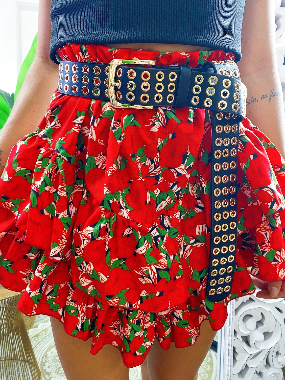 Red asymmetric skirt with flounce and flowers