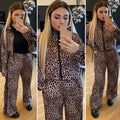 Set due pezzi pantalone e felpa animalier con banda nera - R.a. Boutique 