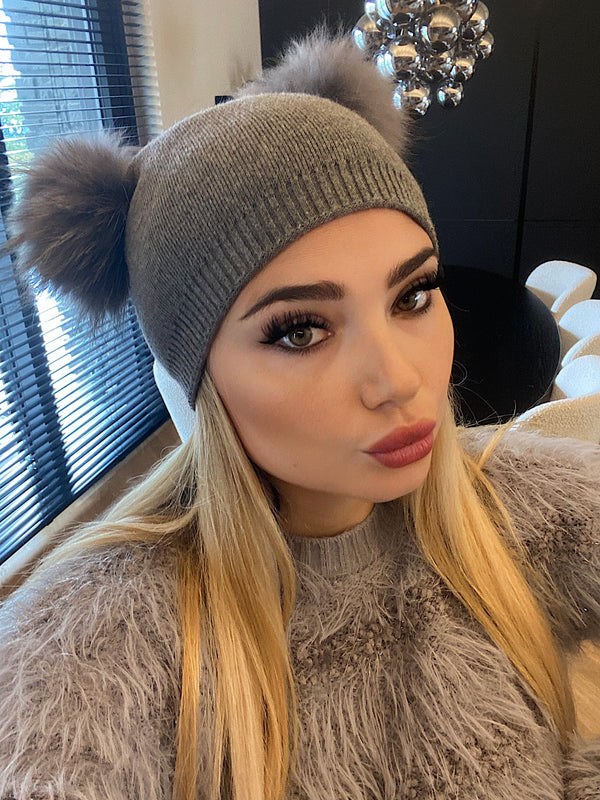 Cappello con pompom