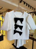 Giacca crop con fiocchi bianco nero - R.a. Boutique