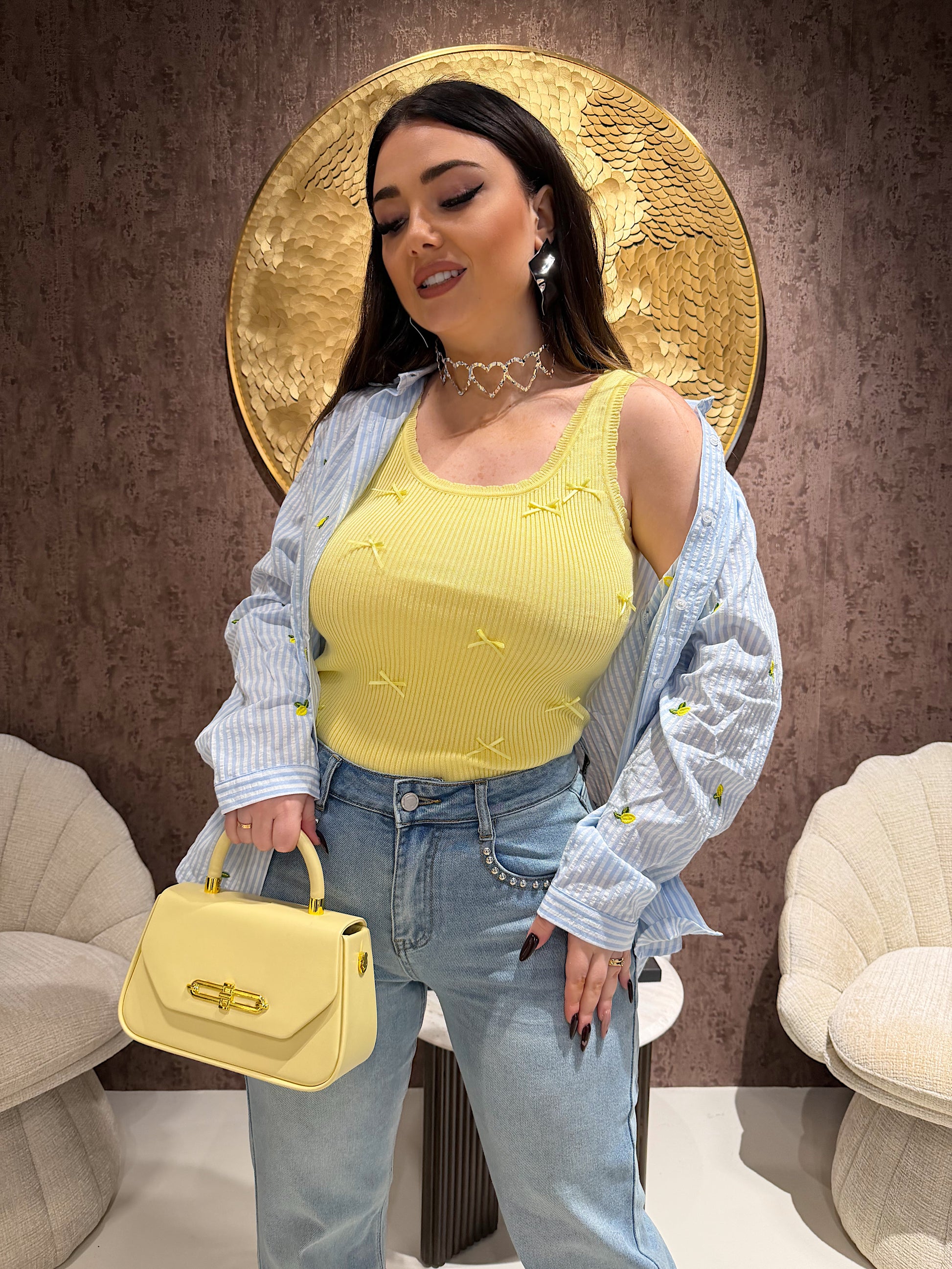 Top a costine con fiocchetti - R.a. Boutique