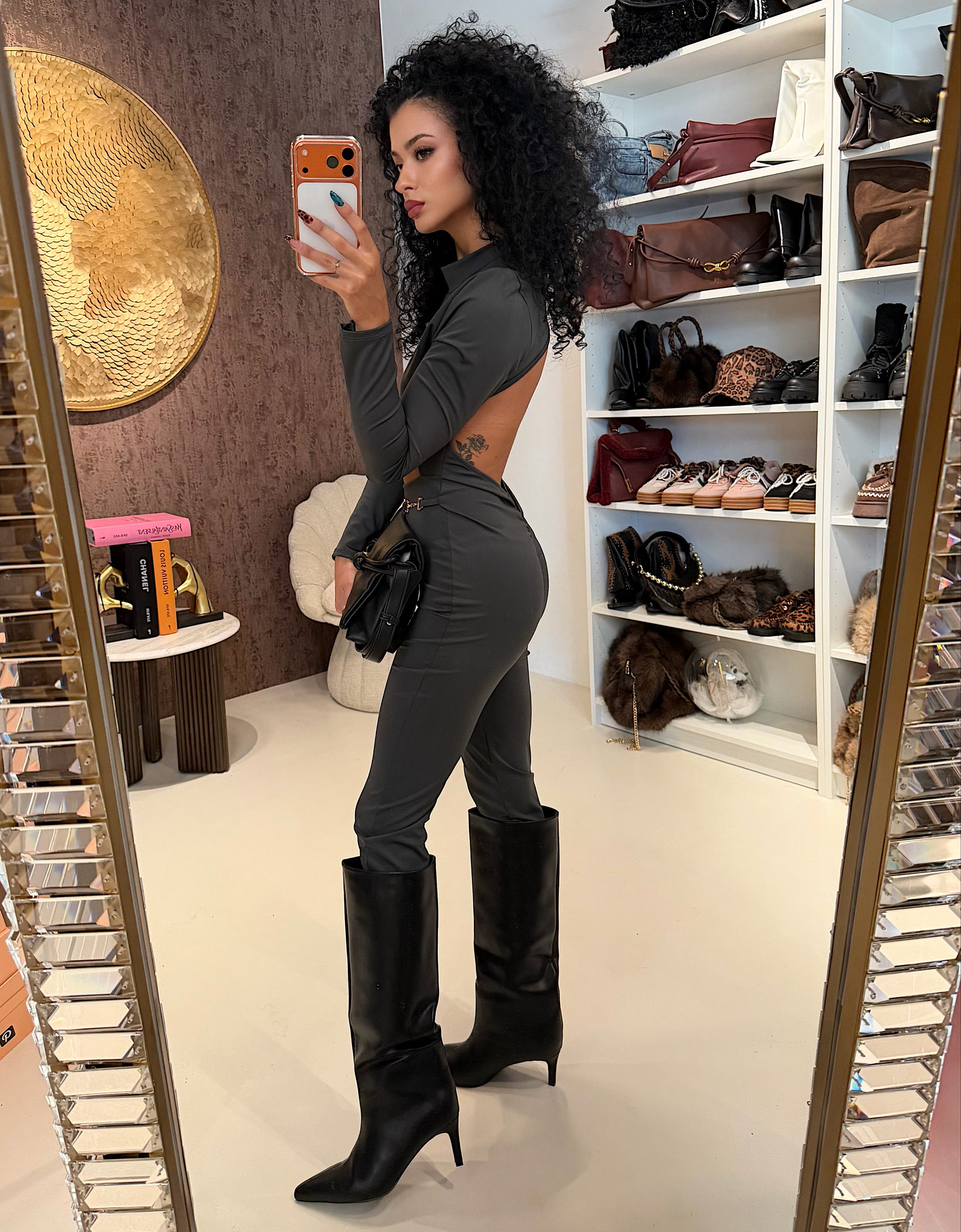 Tuta in lycra grigia schiena aperta e catenina - R.a. Boutique