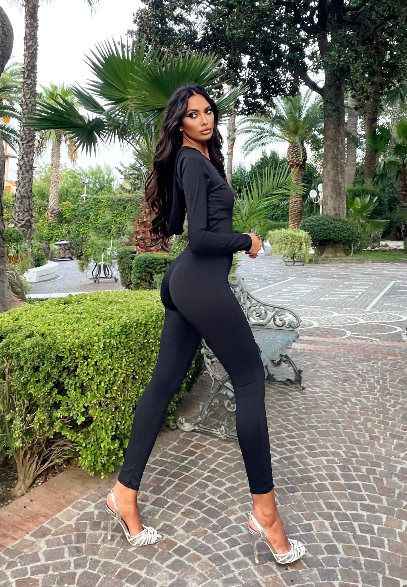 Black jumpsuit with crossed back hood