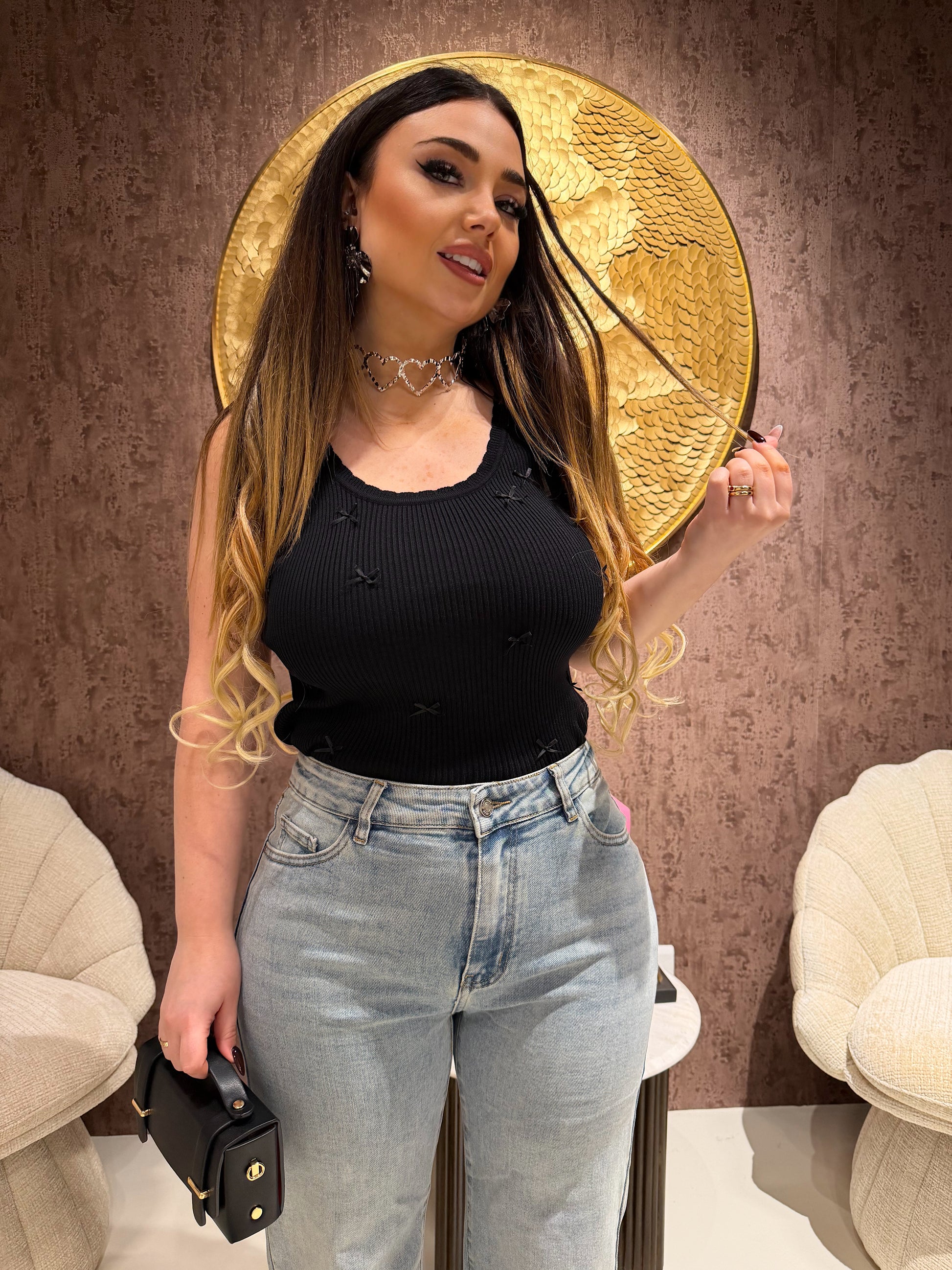 Top a costine con fiocchetti - R.a. Boutique