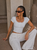 Top con bottoncini e pizzo - R.a. Boutique