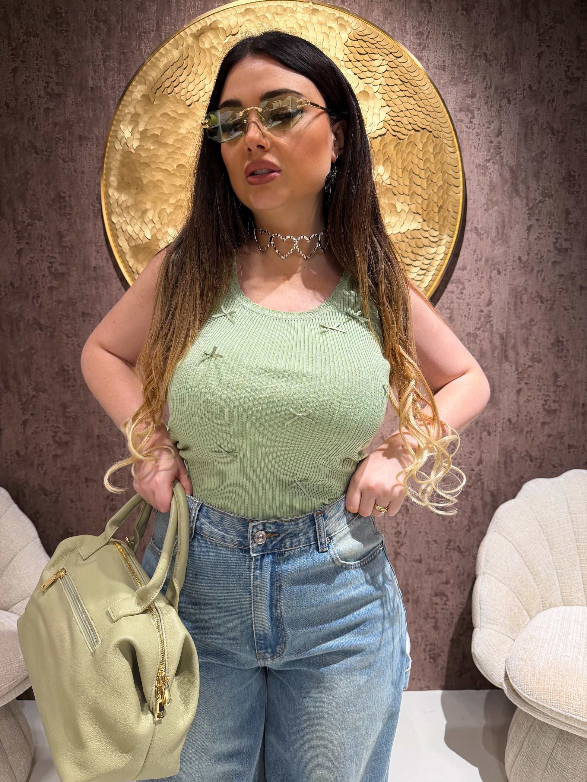 Top a costine con fiocchetti - R.a. Boutique