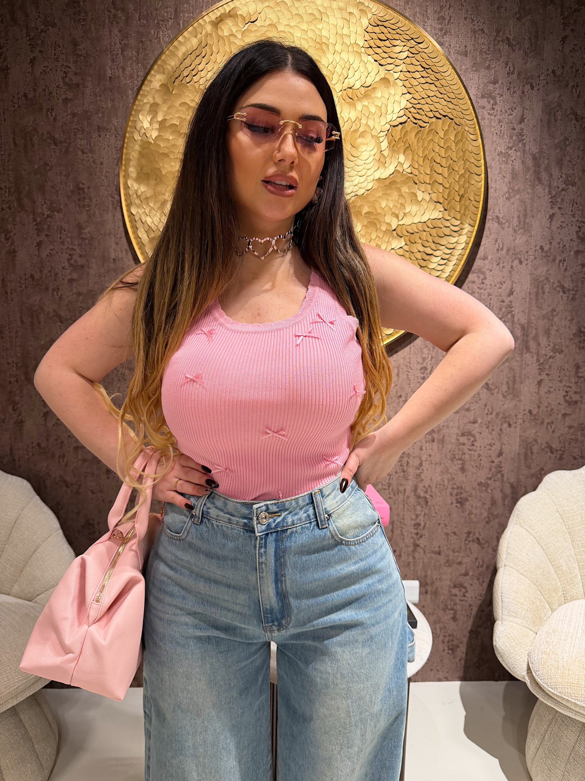 Top a costine con fiocchetti - R.a. Boutique