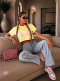 T-shirt cropped gialla con spalline imbottite - R.a. Boutique