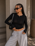 Maglia basic con bottoncini e foro - R.a. Boutique