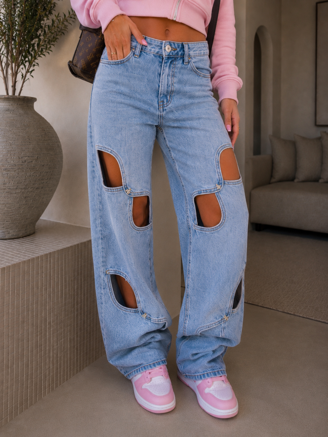 Jeans con aperture e fiocco in strass - R.a. Boutique