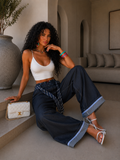 Pantalone con cravatta e risvolto - R.a. Boutique