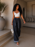 Pantalone con cravatta e risvolto - R.a. Boutique