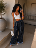 Pantalone con cravatta e risvolto - R.a. Boutique