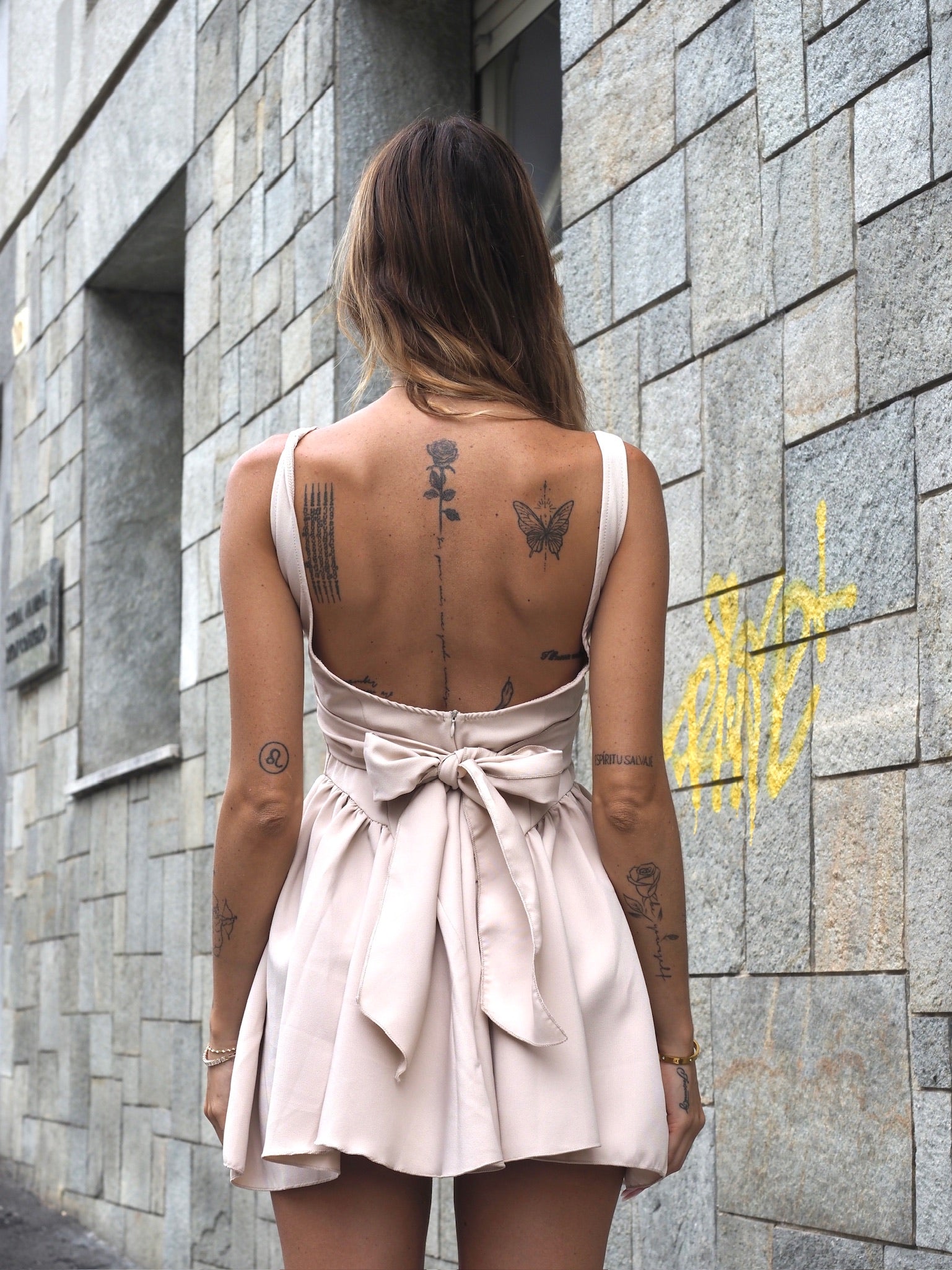 Open back beige dress with bow Open back beige dress with bow