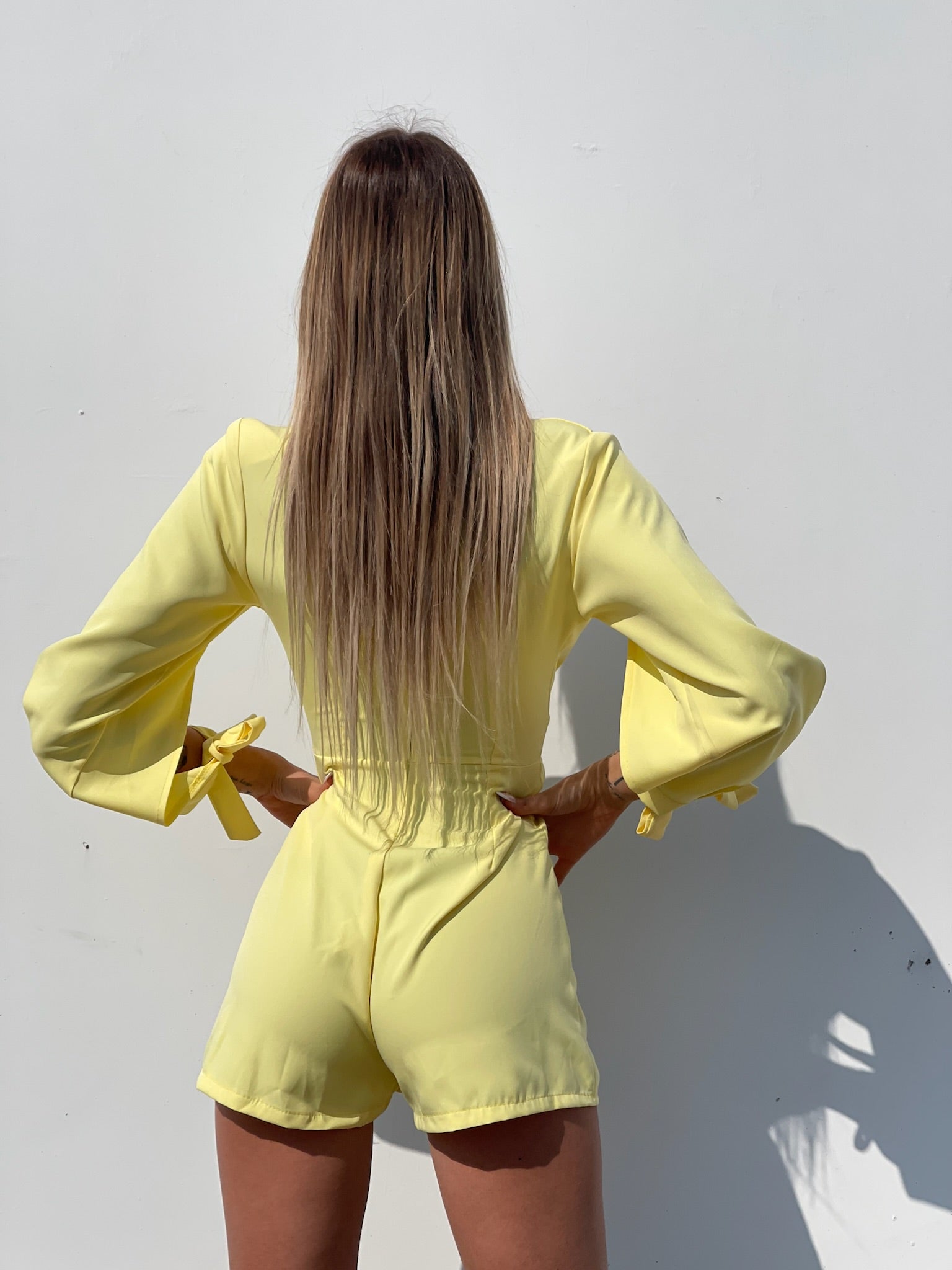 Tutina gialla con fiocchetti - R.a. Boutique 