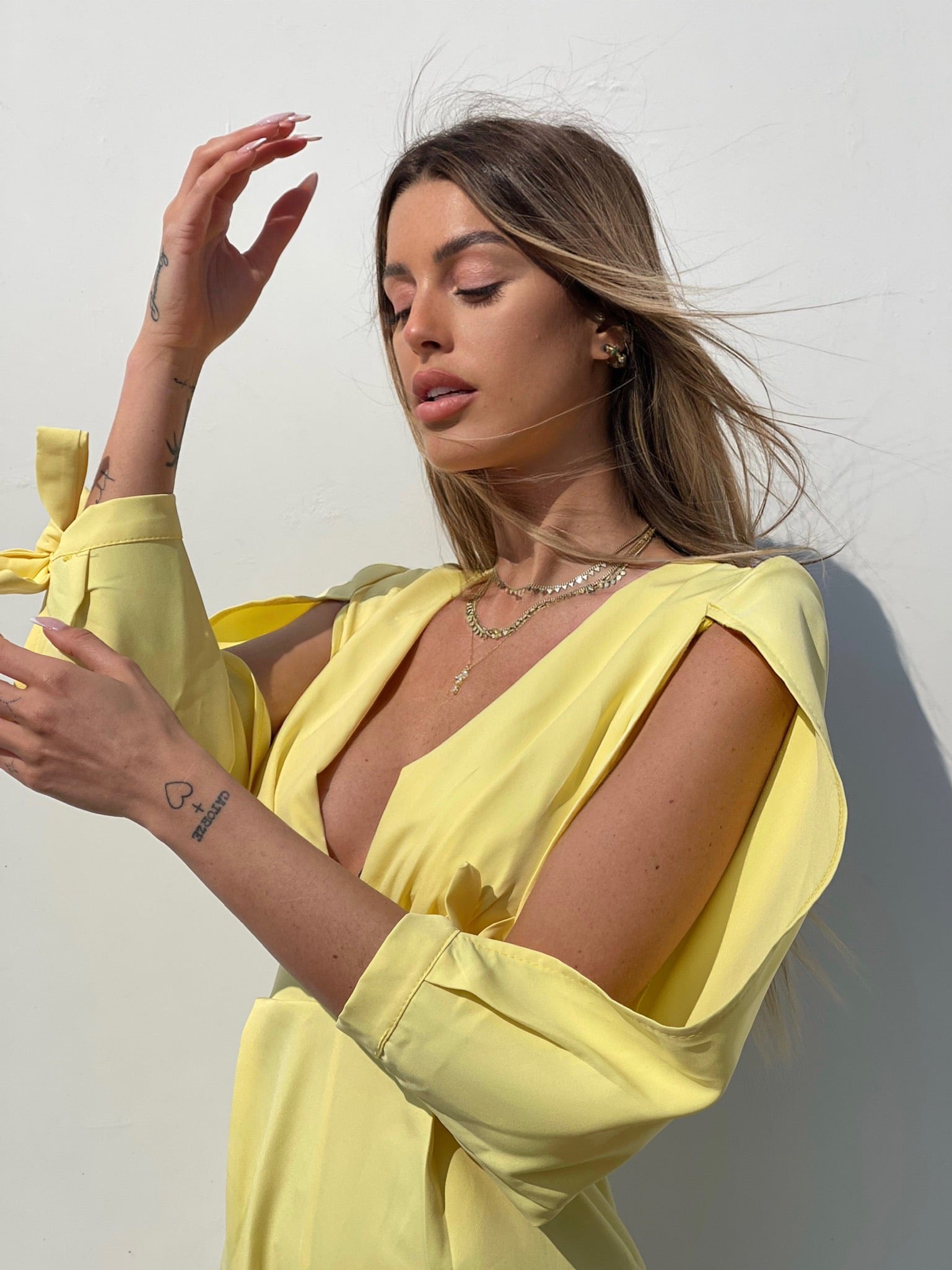 Tutina gialla con fiocchetti - R.a. Boutique 