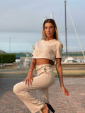 Completo maglia crop e pantalone beige - R.a. Boutique 