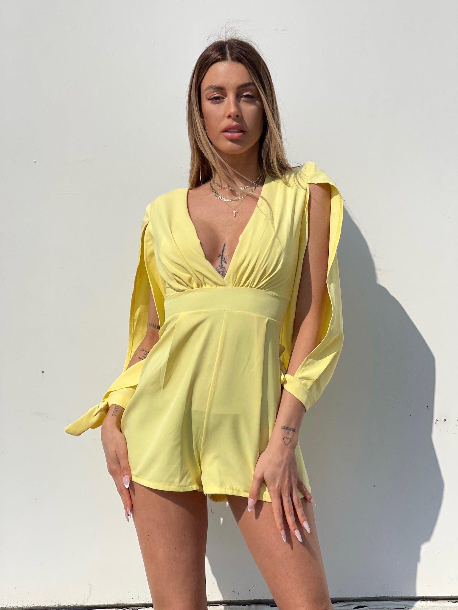 Tutina gialla con fiocchetti - R.a. Boutique 