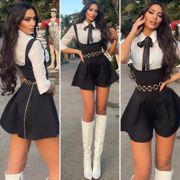 Salopette nera più camicia fiocchetto