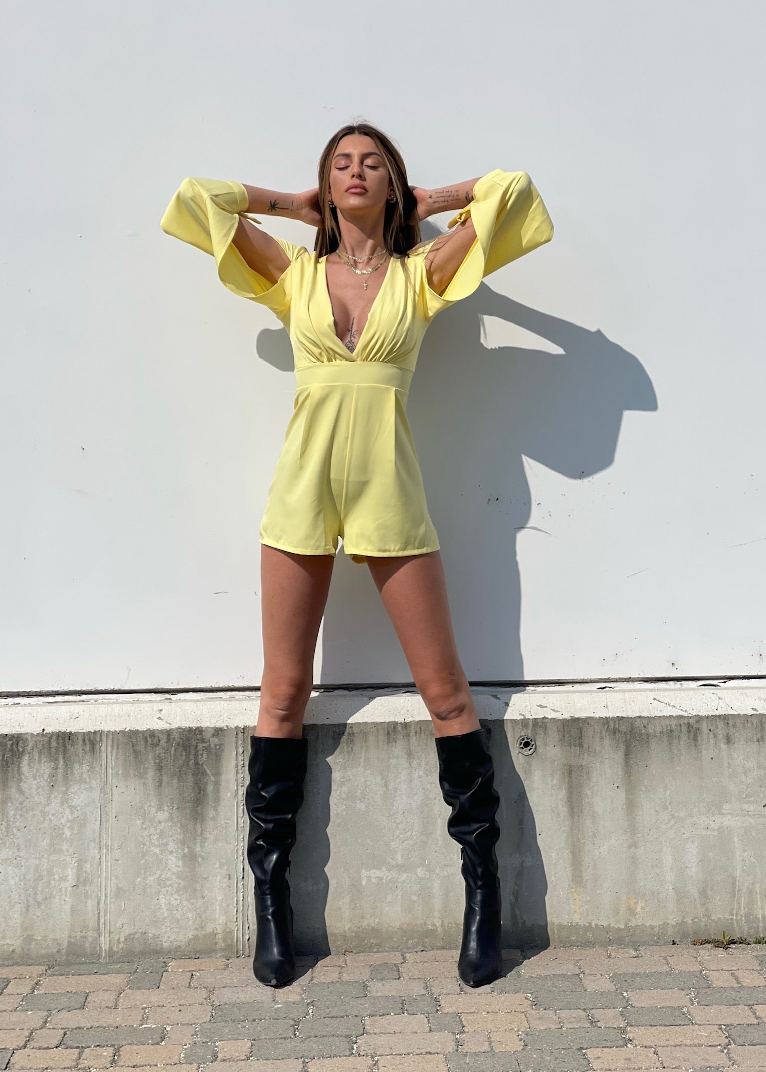 Tutina gialla con fiocchetti - R.a. Boutique 