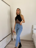 Jeans con strappo e borchie - R.a. Boutique 