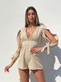 Tutina beige con fiocchetti - R.a. Boutique 