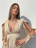 Tutina beige con fiocchetti - R.a. Boutique 