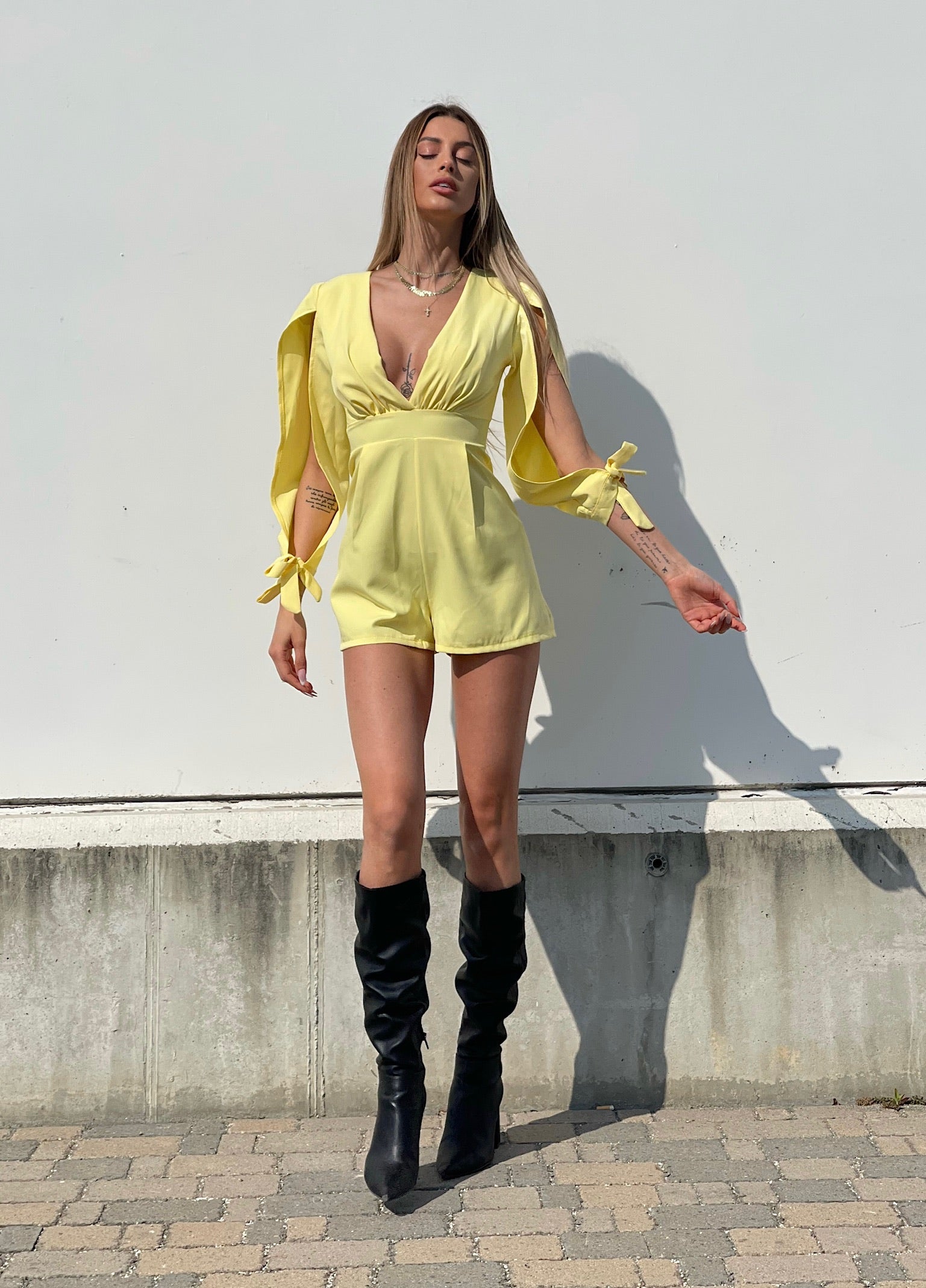 Tutina gialla con fiocchetti - R.a. Boutique 