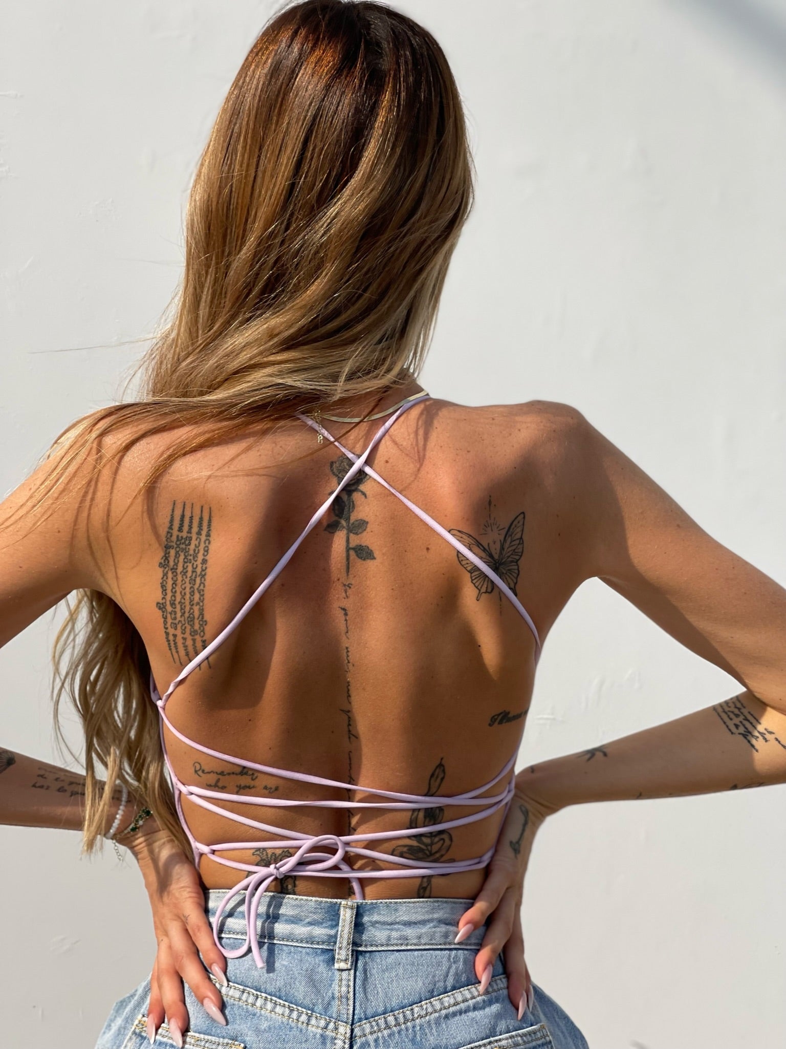 Body aderente con incroci lilla - R.a. Boutique 