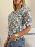 Camicia celeste a manica corta con fiori - R.a. Boutique 