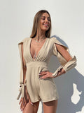 Tutina beige con fiocchetti - R.a. Boutique 