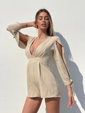 Tutina beige con fiocchetti - R.a. Boutique 