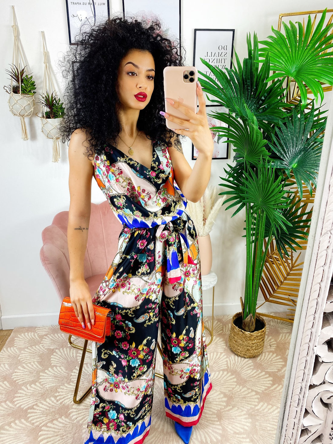 Tuta intera con stampa nera fiori fuxia - R.a. Boutique 