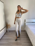 Pantaloni a zampa con strass bianco - R.a. Boutique 