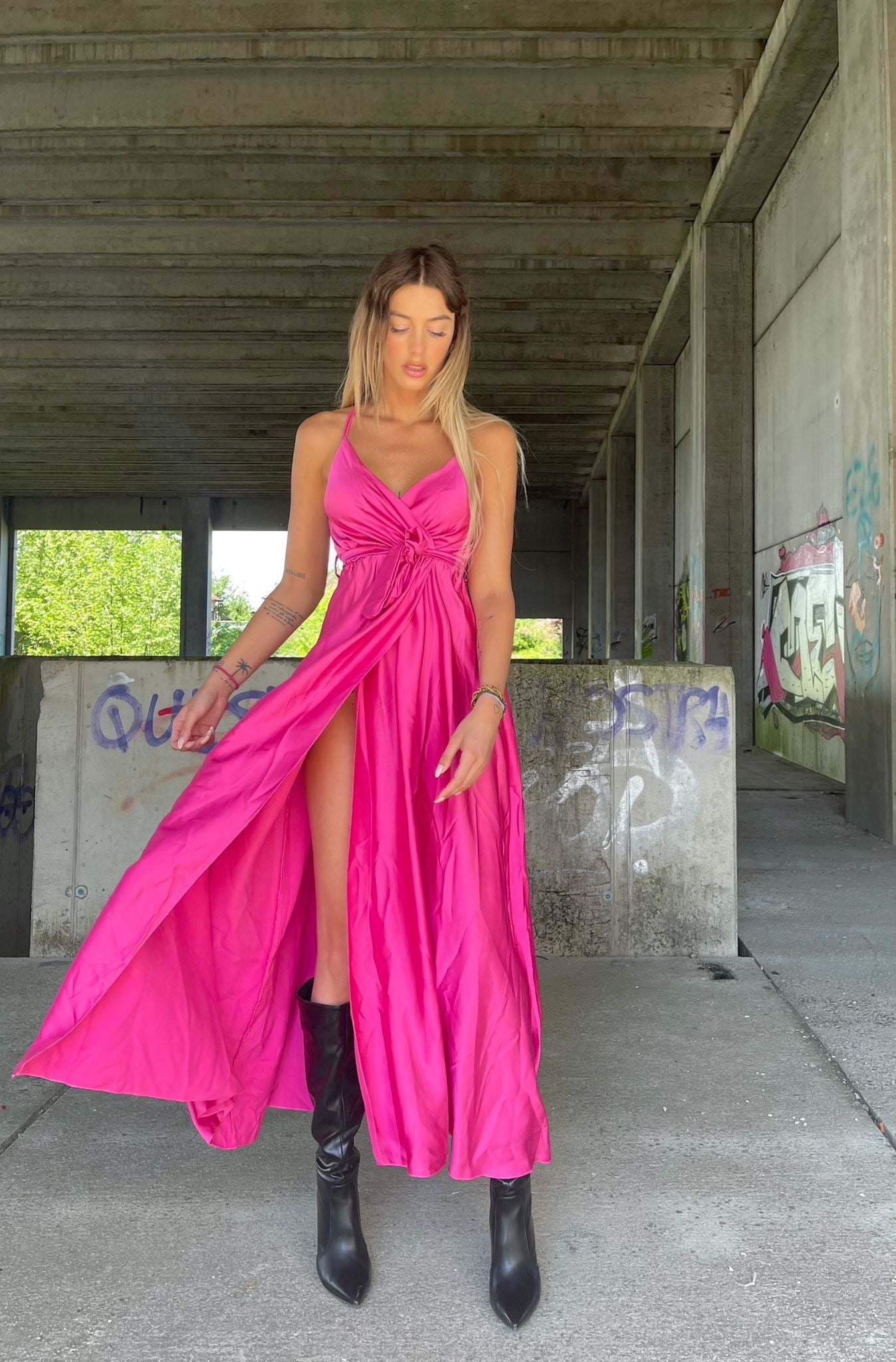 Dress with maxi long slit in low-cut satin. Dress with maxi long slit in low-cut satin.